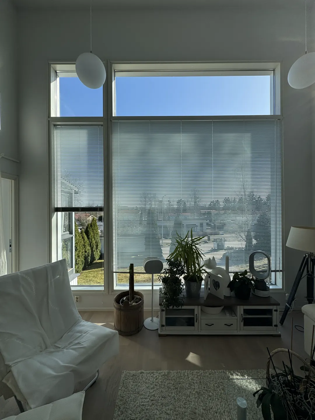 The same living-room window wall before the vertical blinds were installed